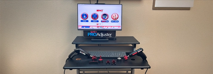 Chiropractic diagnostic workstation featuring ProAdjuster equipment and interface.